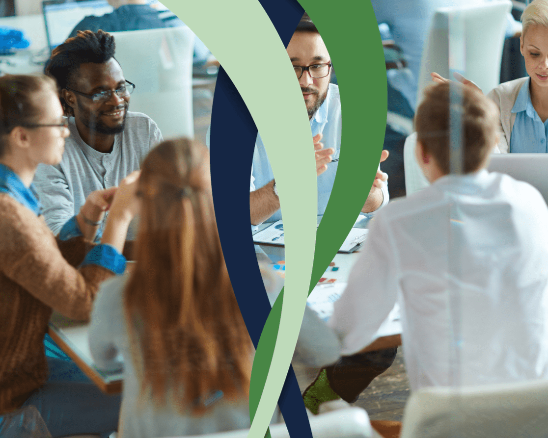 Image representing happy employees at a conference table for HR Compliance Calendar 2024