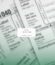 Tax Forms representing people that need to find a tax preparer